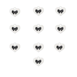 Detailed view of ten white heart alloy pendants featuring elegant black enamel bows