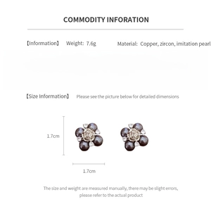 Macro view of geometric flower earrings with zircon and pearls showing size and weight specs