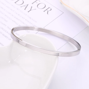 Minimalist silver stainless steel bracelet with a high-polish mirror finish and clasp