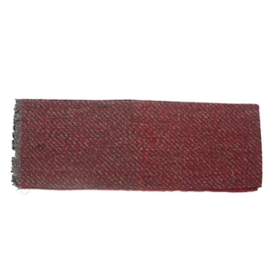 Detailed close-up of dark red knitted scarf texture with short fringe tassels on edge