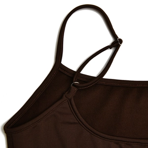 Close-up of adjustable shoulder straps with metal buckles on a brown slim fit dress