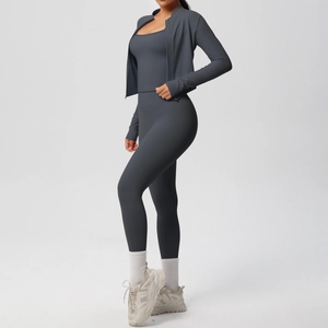 Detail view of dark grey 3-piece yoga set with zip jacket, tank top and leggings