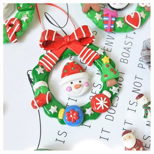 Close-up of festive polymer clay Christmas tree ornaments with colorful 3D bow details
