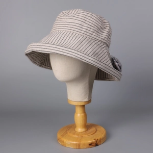 Wide brim striped linen bucket hat for sun protection in a minimalist beige design