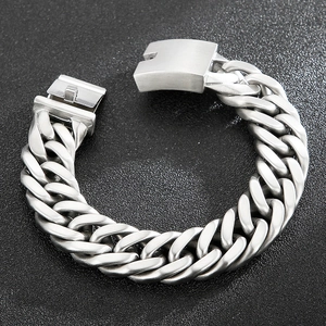 Detail of matte silver Cuban link bracelet featuring a secure integrated folding clasp