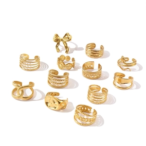 Set of 11 gold 18k plated rings and ear cuffs with butterfly and sun star patterns
