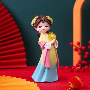 Hanfu girl figurine with colorful dress and fan in traditional Chinese style decor