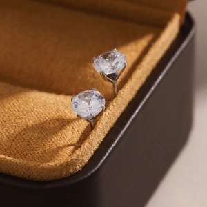 Classic round-cut cubic zirconia stud earrings with silver four-prong stainless steel setting