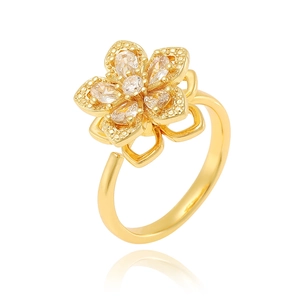 Detailed close-up of a golden flower ring with sparkling gemstones and an adjustable band
