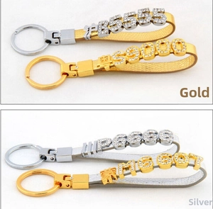 Detailed view of DIY rhinestone letter charms and leather keychains in gold and silver