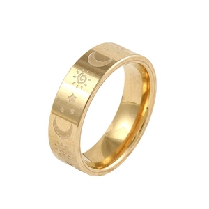 Polished gold stainless steel ring with celestial sun, moon, and star engravings