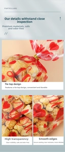 Detail view of heart print OPP bags with secure gold twist ties for candy and popcorn