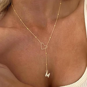 Elegant gold-plated heart and crystal letter M pendant on a beaded satellite necklace