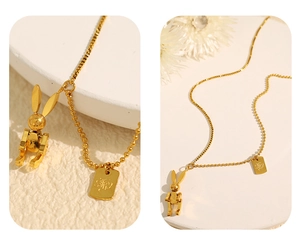 Detail of golden mechanical rabbit pendant with mixed snake and bead chain design