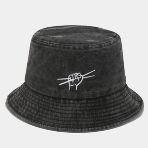 Detail of washed denim bucket hat with white embroidery logo and metal eyelets