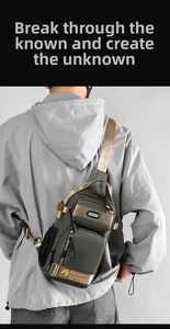 Tactical army green nylon crossbody bag showing multiple pockets and D-ring on the model