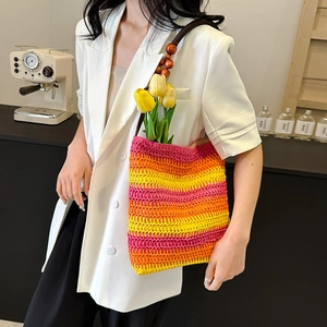 Rainbow striped straw beach bag with wooden bead handle and vibrant woven texture