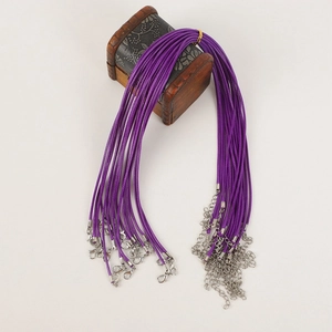 Detail of purple waxed necklace cords with silver lobster clasps and extension chains