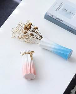 Close-up of modern ceramic vases with gradient colors and elegant textured details