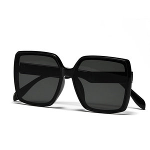 Classic black oversized square frame sunglasses with dark lenses in a minimalist fashion style