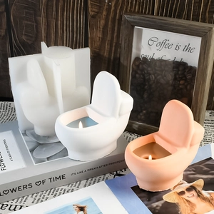 Toilet shaped aromatherapy candle and DIY silicone mold set on a warm wooden background