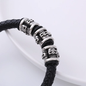 Men's punk woven leather bracelet with vintage silver skulls and magnetic clasp