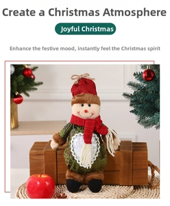 Christmas snowman plush gift bag with red scarf and knitted hat on a wooden box