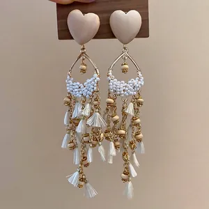 French vintage wooden heart earrings with white beads and elegant long fringe tassels