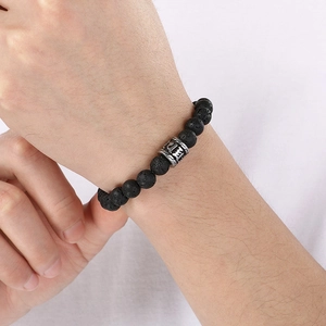 Minimalist black volcanic stone beaded bracelet with engraved silver mantra bead for men