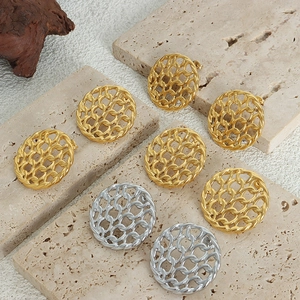 Vintage hollow woven circle stud earrings in gold and silver finish on stone stands