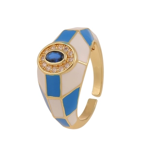 Detail of checkered enamel ring with blue oval stone and cubic zirconia inlay
