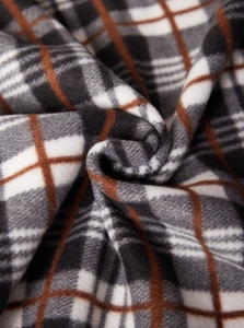 Macro della fodera in pile a quadri marrone e nero per cardigan invernale da uomo
