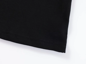 Detail view of double-stitched hem on high-density black modal slim fit T-shirt