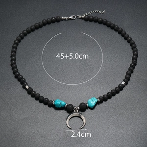 Detail of bohemian beaded necklace with crescent moon pendant and size measurements
