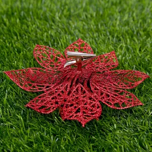 Detail view of red glitter artificial flower with metal alligator clip for Xmas tree