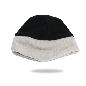 Close-up of dual-tone fleece winter hat showing the soft texture and thick thermal lining