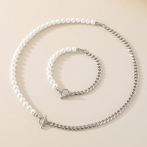 Detail of necklace and bracelet set with half white pearls and silver Cuban chain OT buckle