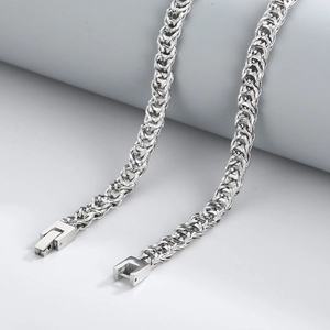 Close-up of silver braided titanium steel chain with a square jewelry clasp for men