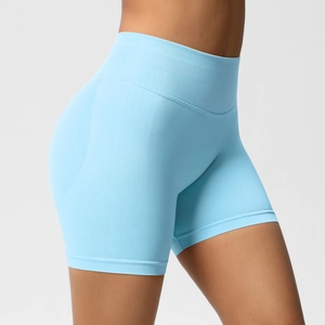 Detail of light blue seamless yoga shorts with high waist and peach hip shaping seams