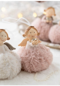 Macro detail of plush angel ornament with golden wings and a soft faux fur base