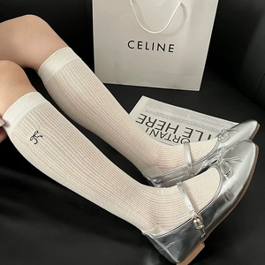 Ballet style cream long socks with side embroidery and silver Mary Jane shoes