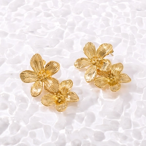 Elegant 18K gold-plated stainless steel flower tassel earrings on white background