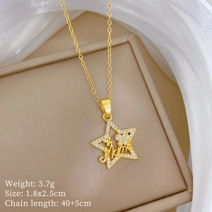 Macro detail of star pendant with Mama lettering and white zircon pavé on jewelry box