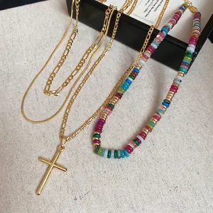 Three-layer 18k gold plated necklace set with cross pendant and rainbow beads on cloth
