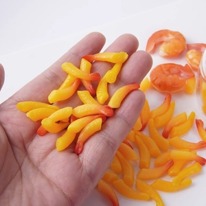 Realistic miniature tempura shrimp resin charms for DIY handmade crafts on palm