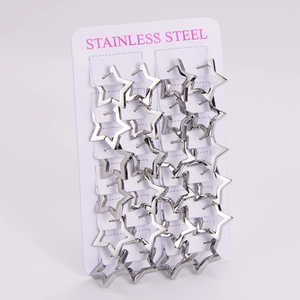 Macro view of silver star shaped stainless steel hoop earrings on display card
