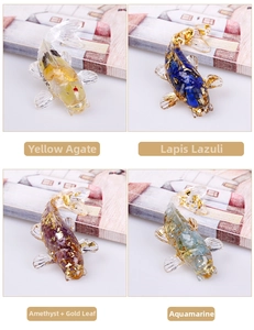 Detailed view of resin koi fish figurines with natural crystal stones and gold foil flakes