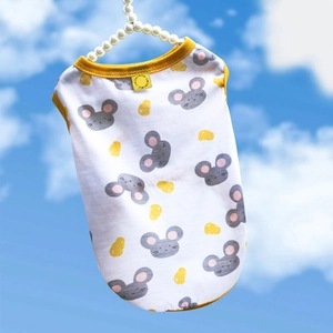 Detail of a white summer dog vest with yellow edges and mouse pattern on a pearl hanger