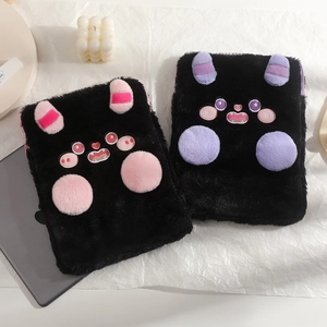 Close-up of cute plush devil iPad sleeve featuring monster ears and detailed embroidery