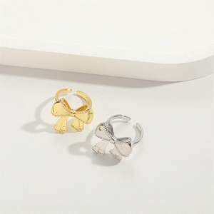 Minimalist adjustable bow-shaped open rings in polished gold and silver finishes